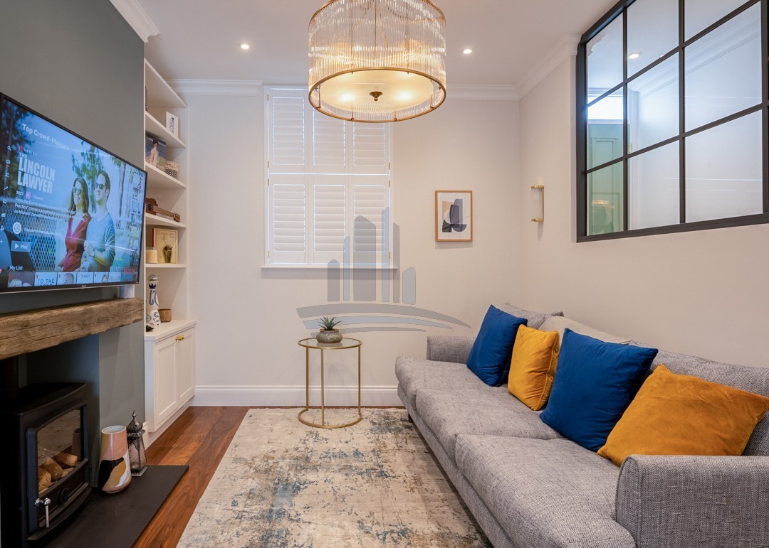 warm classic room in white and grey colours made by loft conversion company london